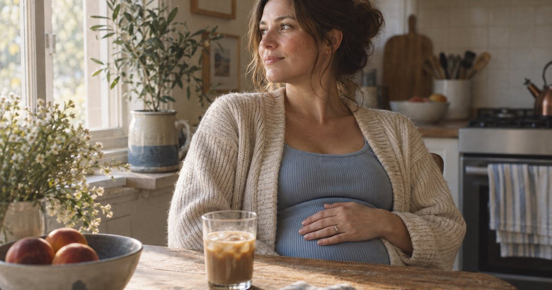 A glass of iced coffee with a condensation ring and a few undissolved powder granules
